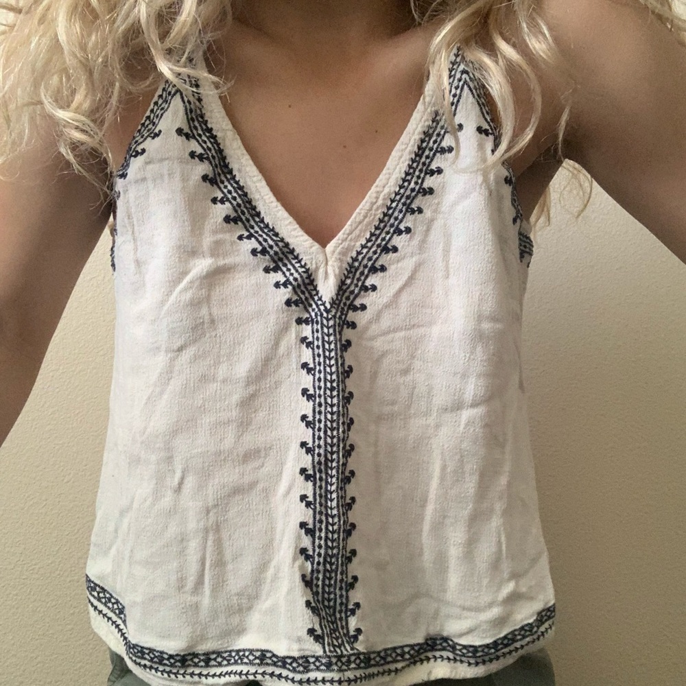 cream top with navy blue detailing